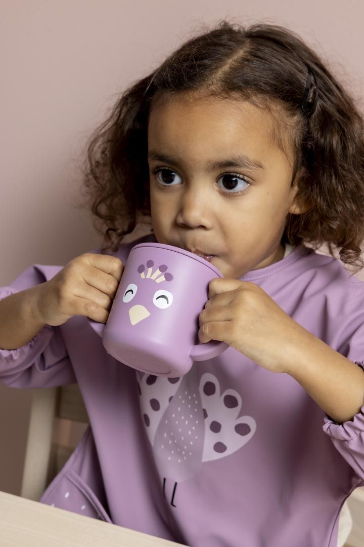 Babero con mangas Mrs. Peacock - Trixie
